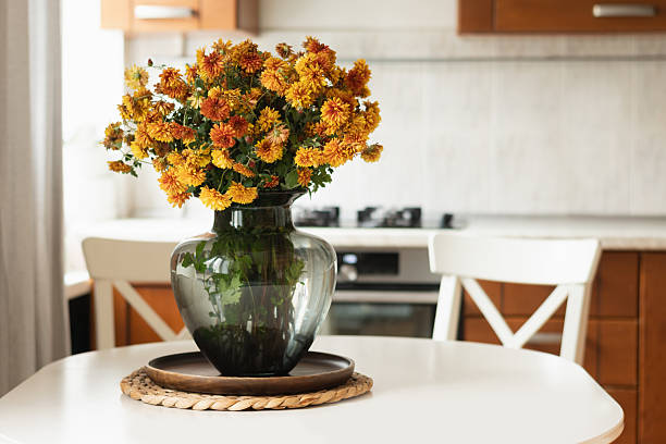 istock Cozy Kitchen Table with Autumn Flowers at Home Interior. 2235057046