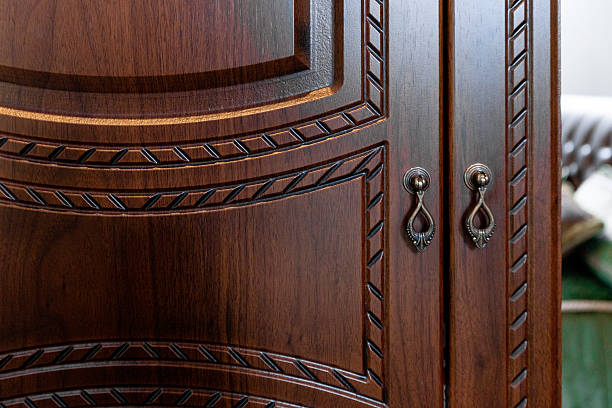 istock A wooden cabinet with a gold handle and a black handle 2235057738