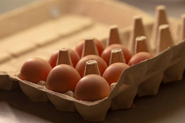 A carton that is fully packed with an assortment of fresh and organic eggs, carefully placed in a tray, showcasing their beautiful natural colors and perfect arrangement for display