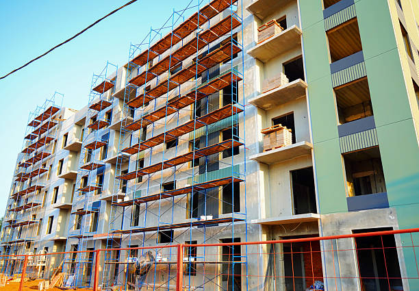 istock Scaffolding for painting residential building during construction. 2235060194