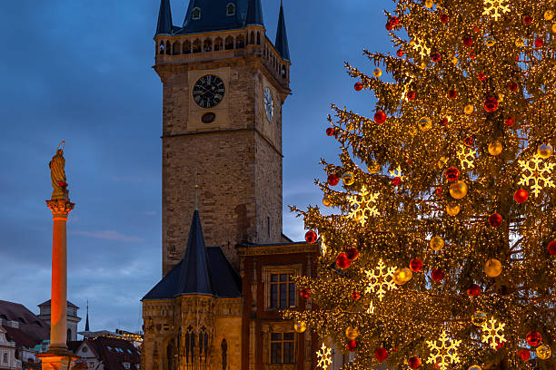 istock Christmas tree illuminating Old Town Hall in Prague at twilight 2235062016