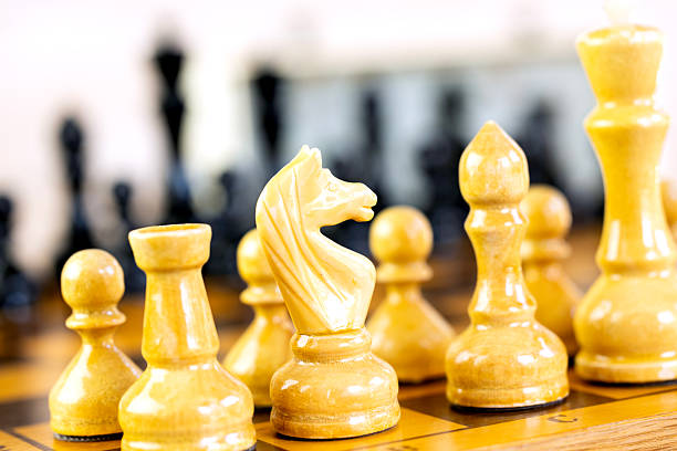 istock Chess pieces on a chessboard on the background of a chess clock 2235062444