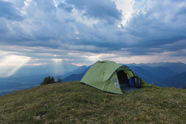 istock Camping under a scenic mountain sky at sunset 2235063508