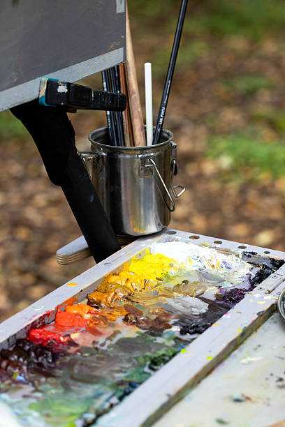 istock The artist mixes multi-colored paints on a palette for drawing. 2235064527