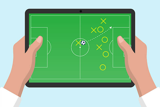 istock Hand holding and touch screen tablet for football soccer tactics 2235065844