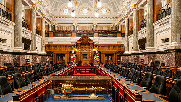 Victoria, BC, Canada - August 29, 2025: Grand stone architecture, copper domes while inside it showcases elegant chambers, stained-glass windows, and historic art celebrating BC's heritage