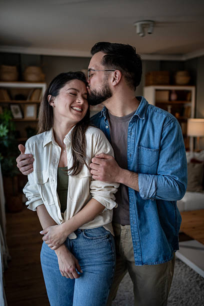 istock Young couple sharing a tender moment at home 2235069543
