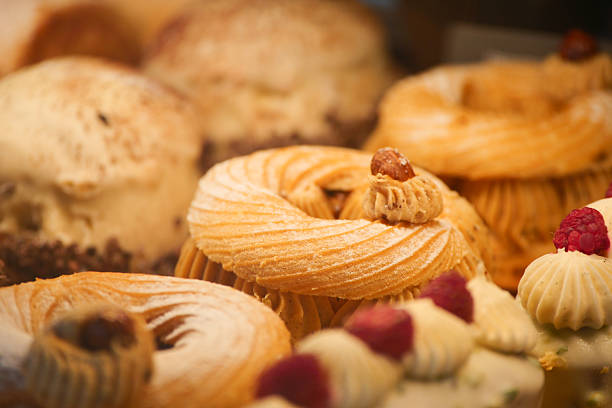 Bakery counter filled with delicious pastries and desserts for customers.