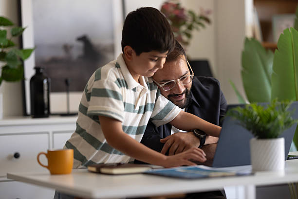 istock Businessman working at home with child. 2235095254