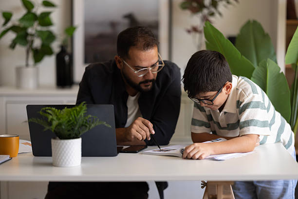 istock Businessman working at home with child. 2235095454