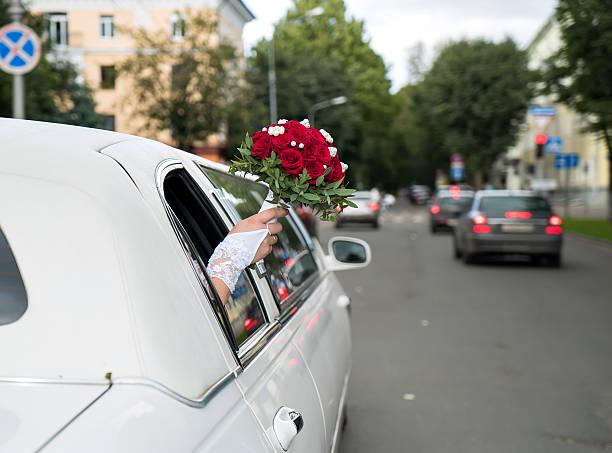 Hobart, Tasmania, Australia, October 27, 2012: View of very long white limousine car being used as wedding car, driving on a street in HobartHobart, Tasmania, Australia, November 29, 2014: View of very long white limousine car being used as wedding car, driving on a street in Hobart