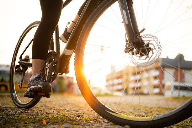 istock Bicycle Wheel With Female Foot On Pedals 2235106269