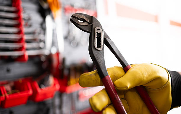 istock Auto Mechanic With Pliers In Service Center 2235107289