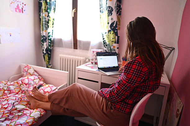istock Mother working from home in child's bedroom using laptop 2235107308
