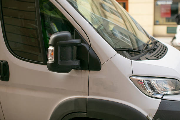 istock A white van is parked by the road in front of a building 2235119459