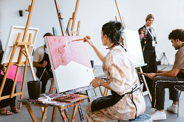 istock Young Middle Eastern Female Artist Painting in Art Class 2235121476