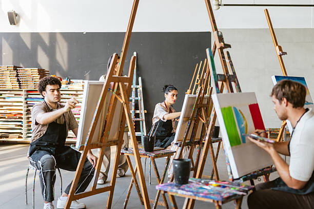istock Diverse Artists Engaged in a Lively Art Class 2235121479