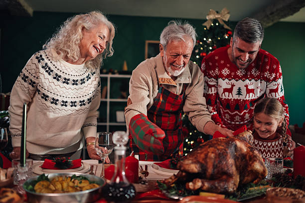istock Family enjoying christmas dinner with roasted turkey 2235124909