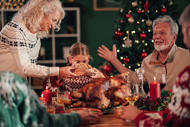 istock Family celebrating christmas dinner with roasted turkey 2235124962