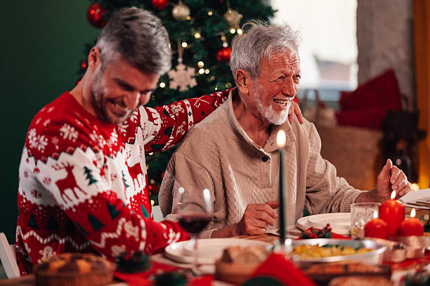 istock Father and son enjoying christmas dinner together 2235128477