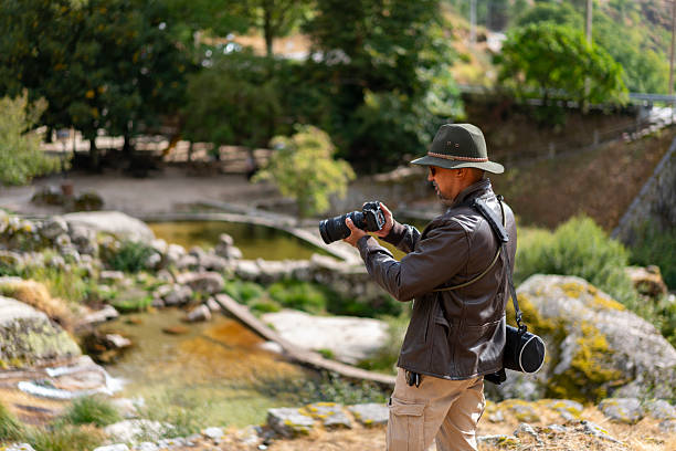 istock Photographer at a river beach in Serra da Estrela 2235128683