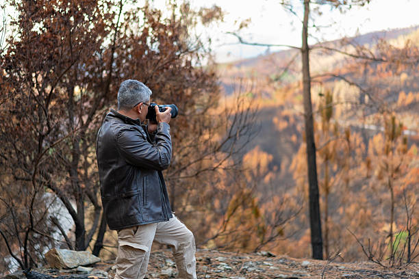 istock Photographer in a burned landscape in Serra da Estrela 2235128873