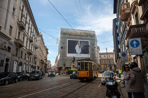 Milan, Italy - May 1, 2024: Downtown street view, Milan, Italy. Tram passing by.