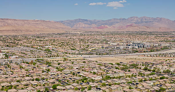 istock Las Vegas Beltway Cutting Between Subdivisions in Spring Valley, NV - Aerial 2235130089