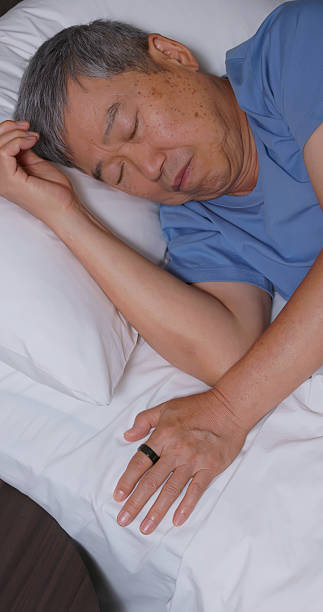 istock asian elderly wear smart ring sleeping home 2235131796