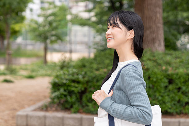 istock attractive asian woman going out 2235132799