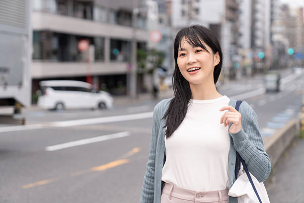 istock attractive asian woman going out 2235132823