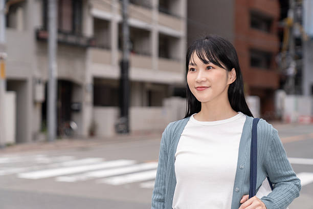 istock attractive asian woman going out 2235132925