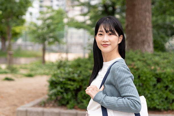 istock attractive asian woman going out 2235132945