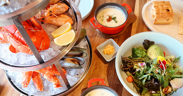 Fresh seafood platter with lobster, shrimp, mussels on ice, gourmet