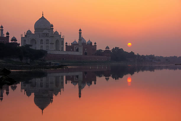 istock Taj Mahal reflected in Yamuna river at sunset in Agra, India 2235141697