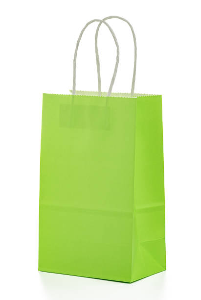 istock Green paper bag with white handles on white background 2235144474