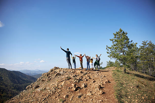 istock Adults and children hiking mountain 2235147440