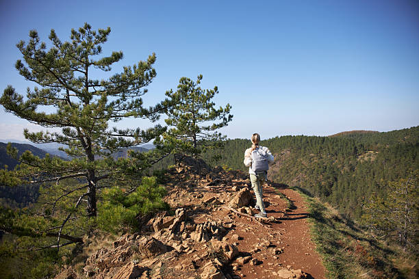 Young woman hiking mountain.