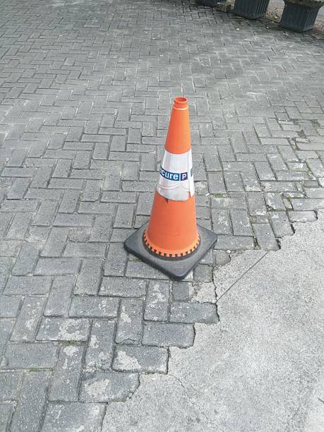 istock Orange Traffic Cone on Paved Street 2235149051