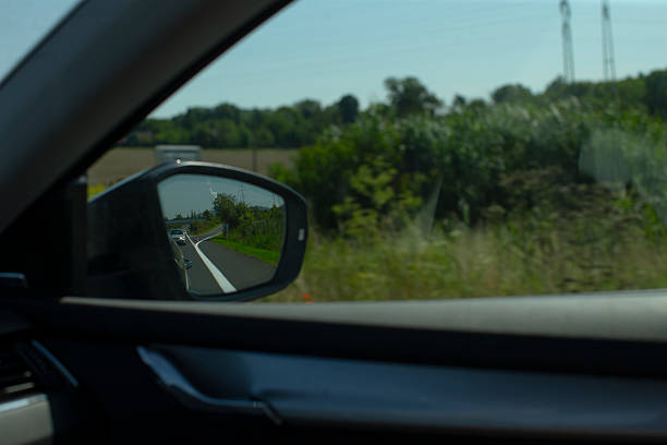 istock A Clear and Beautiful View of the Open Road Reflected in the Side Mirror 2235150510