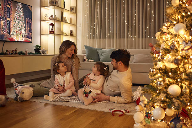 Beautiful family on Christmas Eve stock photo