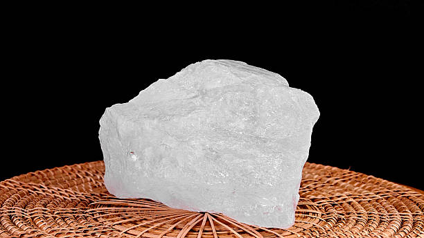 istock Potassium alum stones on black background. 2235152225