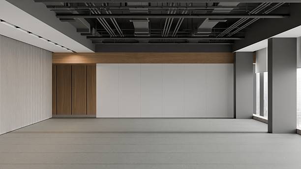 istock Interior of a modern, empty open-plan office space with industrial design elements and a concrete floor 2235153013