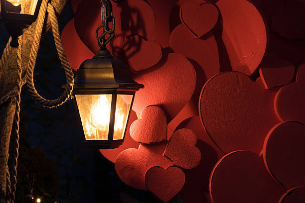 Saint Valentine romance holiday local view twilight dusk condition with lantern light on red hear shape elements decoration background wall advertising concept