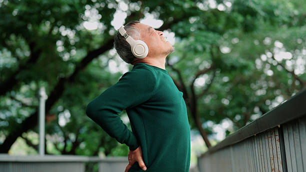istock Aging Asian male experiencing lower back discomfort during outdoor physical activity 2235158427