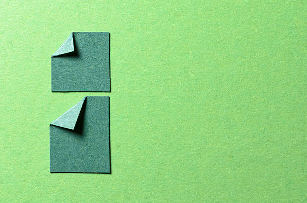 A yellow and blue sticky note is stuck to a red background. The note is blank, which could suggest that it is a reminder or a to-do list. The red background adds a bold