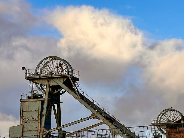 istock Two disused pit head wheels against cloudscape in Northumberland 2235166026