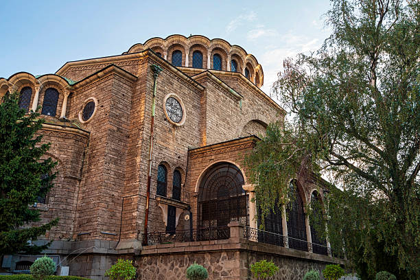 Exterior of Saint Nedelya Church in Sofia, Bulgaria, a historic Orthodox cathedral with large dome, stone walls, and arched windows.