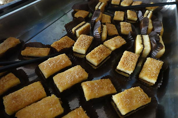 A typical breakfast at a Jiangxi hotel offers a delightful taste of local flavors. Guests can expect a variety of steamed buns, including savory pork and sweet red bean paste fillings. Healthy options like steamed sweet potato, lotus root chunks, and white radish are common. The spread is complemented by classic Chinese items such as crispy fried dough sticks (youtiao) and fluffy, slightly sweet fermented rice cakes (fagao). This balanced meal provides both energy and a genuine culinary experience.
