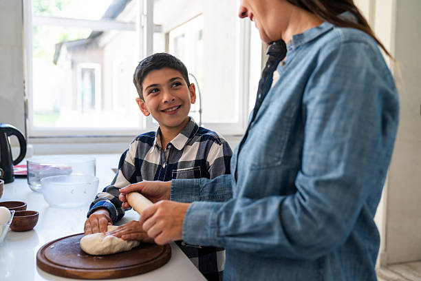 istock Mother and Son Enjoy Baking Together at Home 2235173807